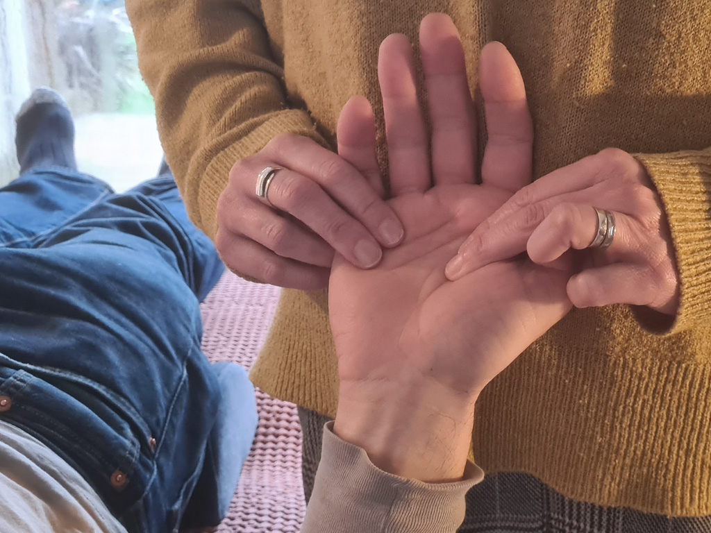 Kinesiology treatment to hand